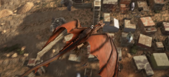 The Fire Wyvern flying over the large village from the Scorched Earth Trailer.